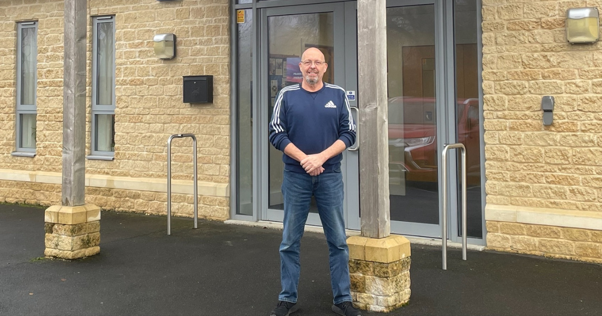 Andy Wakefield stood in front of the Upper Rissington Village Hall entrance